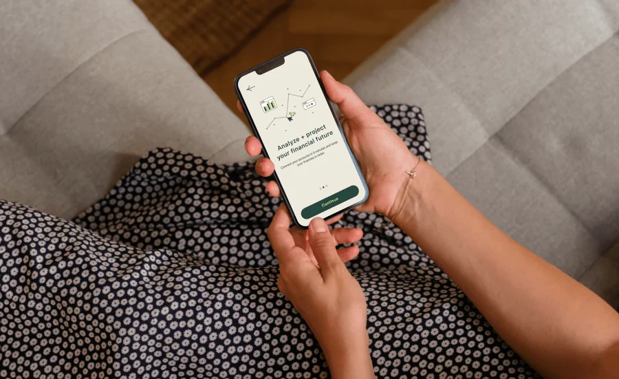 Woman holding phone with Advice Co interface on screen